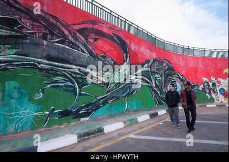 Libya, Tripoli: After Gadaffi's death quite a few graffiti artists began spraying their murals on public walls. Stock Photo