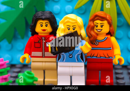 Tambov, Russian Federation - July 24, 2016 Three Lego girl make selfie. Studio shot. Stock Photo