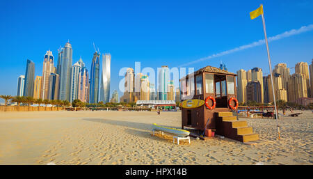 JUMEIRAH BEACH IN DUBAI,UNITED ARAB EMIRATES-FEBRUARY 25, 2016: View from Jumeirah beach on modern skyscrapers in Dubai Marina
