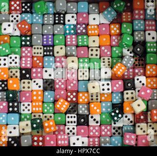 Different colored dice on an abstract cement-like background Stock ...