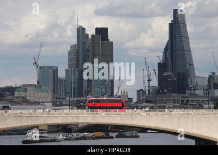 A Scenic view of a CT Plus Alexander Dennis Enviro 400 City red London Bus crossing Waterloo Bridge with cityscape including St. Paul's and The Shard. Stock Photo
