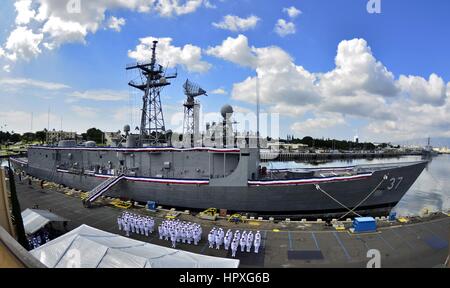 Sailors stand in formation in front of guided-missile frigate USS Crommelin (FFG 37) during its decommissioning ceremony on Joint Base Pearl Harbor-Hickam, Hawaii, 2012. Image courtesy Daniel Barker/US Navy. Stock Photo
