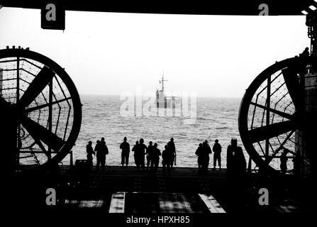 Sailors wait to perform a stern gate marriage with a utility landing craft in the well deck of the amphibious transport dock ship USS Green Bay, January 8, 2013. Image courtesy US Navy Mass Communication Specialist 1st Class Elizabeth Merriam. Stock Photo