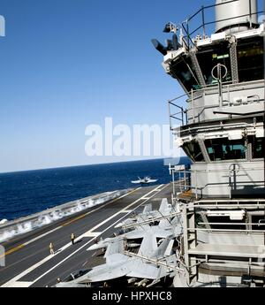 An F/A-18 Hornet assigned to the Zappers of Electronic Attack Squadron launches from the aircraft carrier USS Harry S. Truman, January 23, 2013. Image courtesy Kameren Guy Hodnett/US Navy. Stock Photo