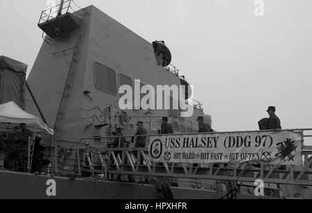 Sailors assigned to the USS Halsey board the ship, January 25, 2013. Image courtesy Tim D Godbee/US Navy. Stock Photo