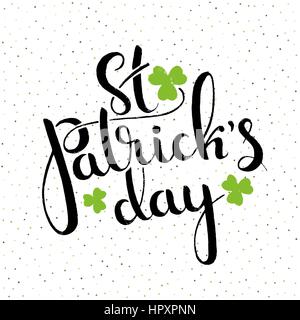 St. Patrick's Day handwritten lettering with shamrock leaves. Modern vector hand drawn calligraphy over dotted background for your design Stock Vector