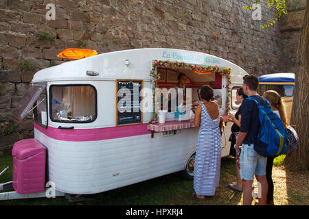 People around Montjuic castle in the city of Barcelona, for a city festival with different food trucks Stock Photo