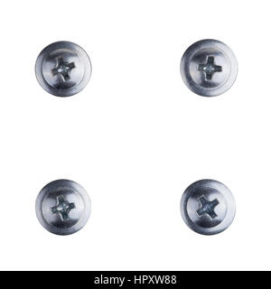 Four screw heads of silver color with path for the cross screw-driver Stock Photo