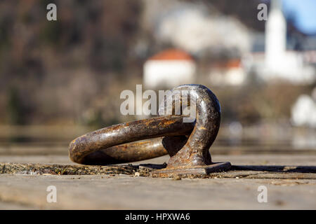 Large metal hooks on quay for mooring boats, Stock Photo