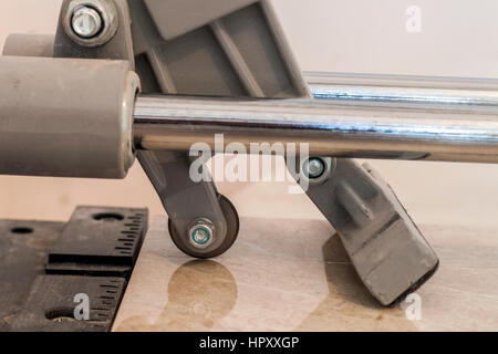 Ceramic tiles and tools for tiler. Floor tiles installation. Home improvement, renovation - ceramic tile cutting tool. Stock Photo