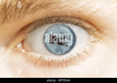 A close-up of an eye with the pupil in the shape of Papa New Guinea.(series) Stock Photo