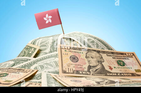 The national flag of Hong Kong sticking in a pile of american dollars.(series) Stock Photo