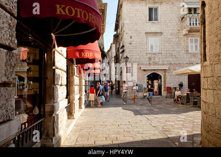 Kotor, Montenegro - August, 2016: Street with tourists walking in Kotor old town. Stock Photo