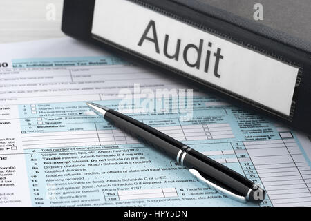 Folder label audit on the table with the tax form Stock Photo