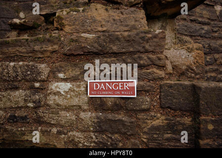 danger do not climb on walls sign Stock Photo