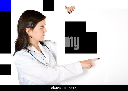 friendly female doctor over white pointing at a white card Stock Photo