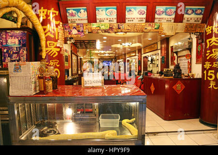 Snake themed restaurant at the Taipei Huaxi Street Tourist Night Market in Taipei, Taiwan. Stock Photo
