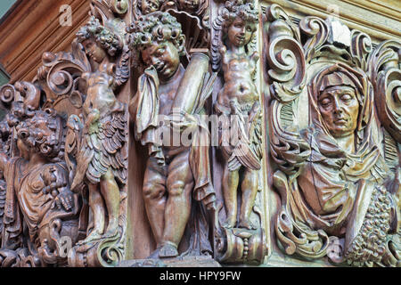 BRUGGE, BELGIUM - JUNE 12, 2014: The carved statues of angels on the pilpit in st. Jocobs church (Jakobskerk) by B. de Lannoy (1685-1689). Stock Photo