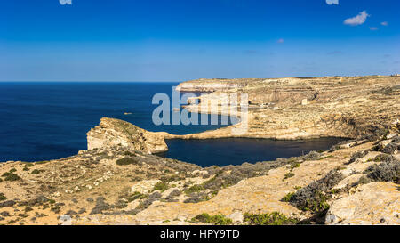 Gozo, Malta - Panoramic view of the famous Azure Window with the Fungus rock and Dwejra bay on a beautiful summer day with clear blue sky