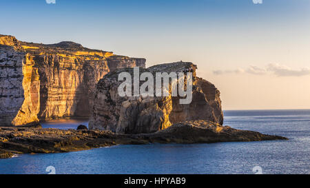 Gozo, Malta - The famous Fungus rock on the island of Gozo at Dwejra bay at sunset