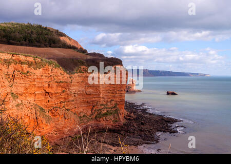 Sidmouth. High Peak rising above the sea between Sidmouth and Ladram Bay, on the South West Coastal Path, Devon Stock Photo