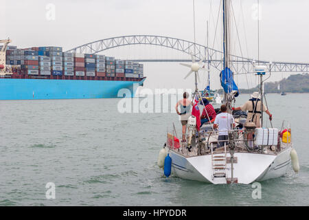 Big Containervessel passing the bridge of the americas in Panama city Stock Photo