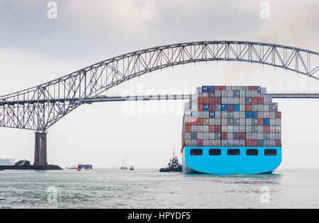 Big Containervessel passing the bridge of the americas in Panama city Stock Photo