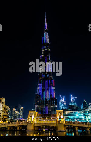 View of illuminated Burj Khalifa and a bridge at night Stock Photo