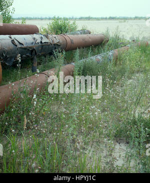 pipe engineering construction on sand. warehouse large pipes under open sky Stock Photo