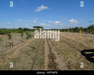 Railtrack in the cuban countryside landscape from the Valle de los Ingenios near Trinidad Stock Photo