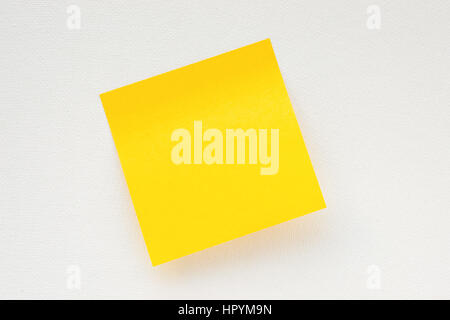 Yellow sticky note on white canvas background. Memo template Stock Photo