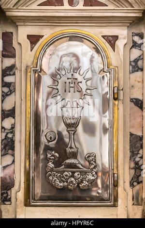 Detail of a tabernacle in a Catholic church in which are preserved the consecrated hosts after the Eucharistic celebration. Stock Photo