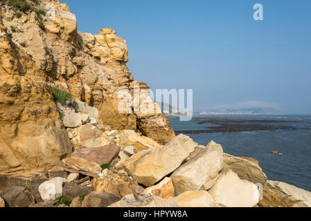 View from Knipe point (Osgodby point) near Scarborough on the coast of North Yorkshire, England. A beautiful sunny day on the rocky headland. Stock Photo