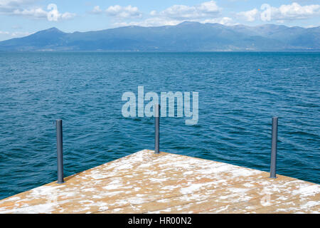 Lake with wooden platform or pier Stock Photo
