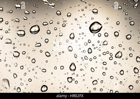 Water drops on a window pane, glass pane, window, rain, bad weather, full-frame, background image Stock Photo