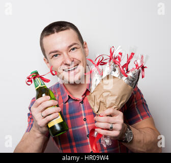 man satisfied with the bouquet of fish and beer Stock Photo