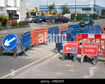 Road works with safety barriers blocking pedestrian footpath Stock Photo