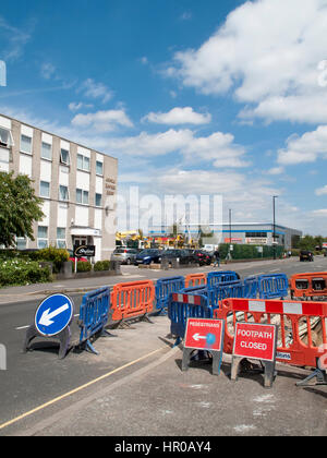 Road works with safety barriers blocking pedestrian footpath Stock Photo