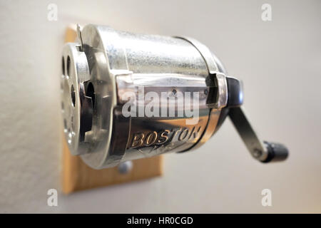 Pencil sharpener mounted on a wall. Stock Photo