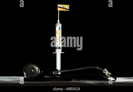Stethoscope and syringe filled with drugs injecting the Brunei flag on a black background Stock Photo