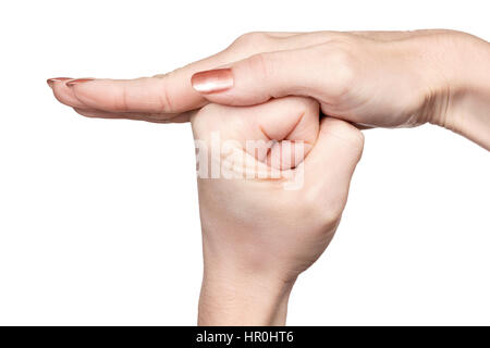 Gesture female hands palm of one hand covers the other fist isolated on white background Stock Photo