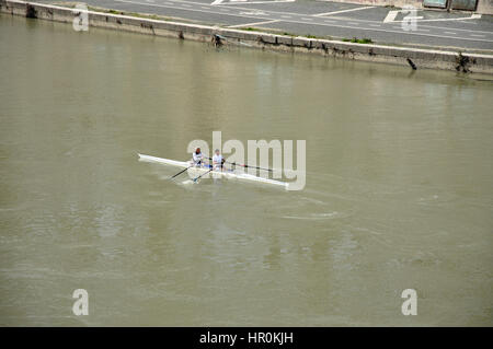 ROME, ITALY - MARCH 14, 2016: Team canoeing on the river Tiber in the city of Rome, Italy Stock Photo