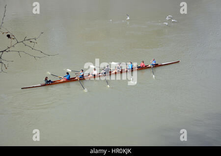 ROME, ITALY - MARCH 14, 2016: Team canoeing on the river Tiber in the city of Rome, Italy Stock Photo