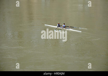 ROME, ITALY - MARCH 14, 2016: Team canoeing on the river Tiber in the city of Rome, Italy Stock Photo