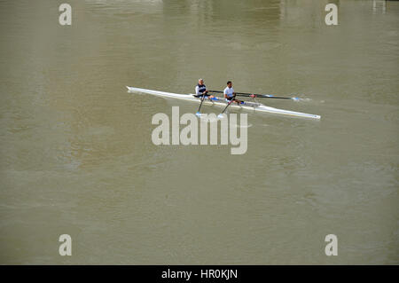 ROME, ITALY - MARCH 14, 2016: Team canoeing on the river Tiber in the city of Rome, Italy Stock Photo