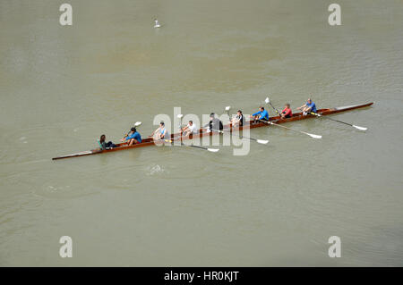 ROME, ITALY - MARCH 14, 2016: Team canoeing on the river Tiber in the city of Rome, Italy Stock Photo