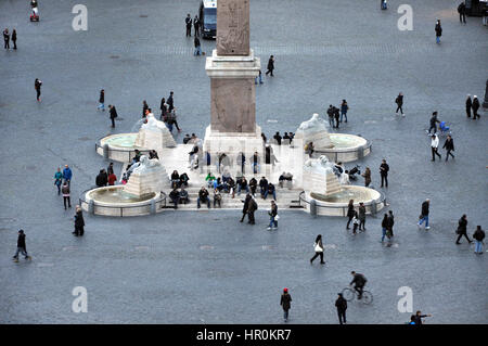 ROME, ITALY - MARCH 14, 2016: Tourists visiting the Piazza del Popolo in Rome, one of major squares of the city Stock Photo