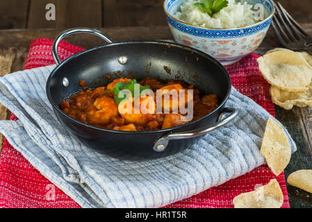 Prawn curry with rice and popodoms Stock Photo