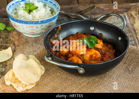 Prawn curry with rice and popodoms Stock Photo