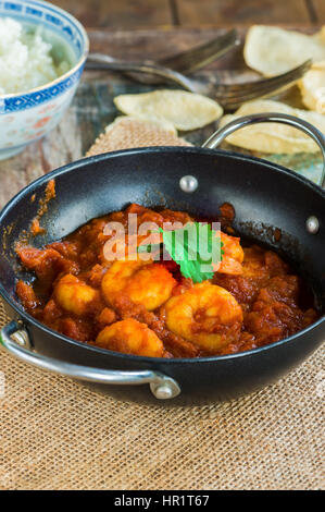 Prawn curry with rice and popodoms Stock Photo